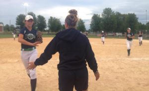 Fleming welcomes her team back into the dugout.