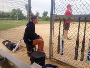Fleming calls pitches from her spot inside the fence